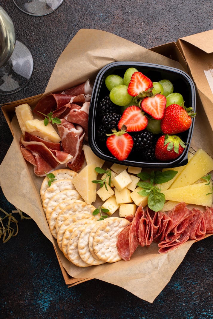 Cheese and meat assortment in a to go box